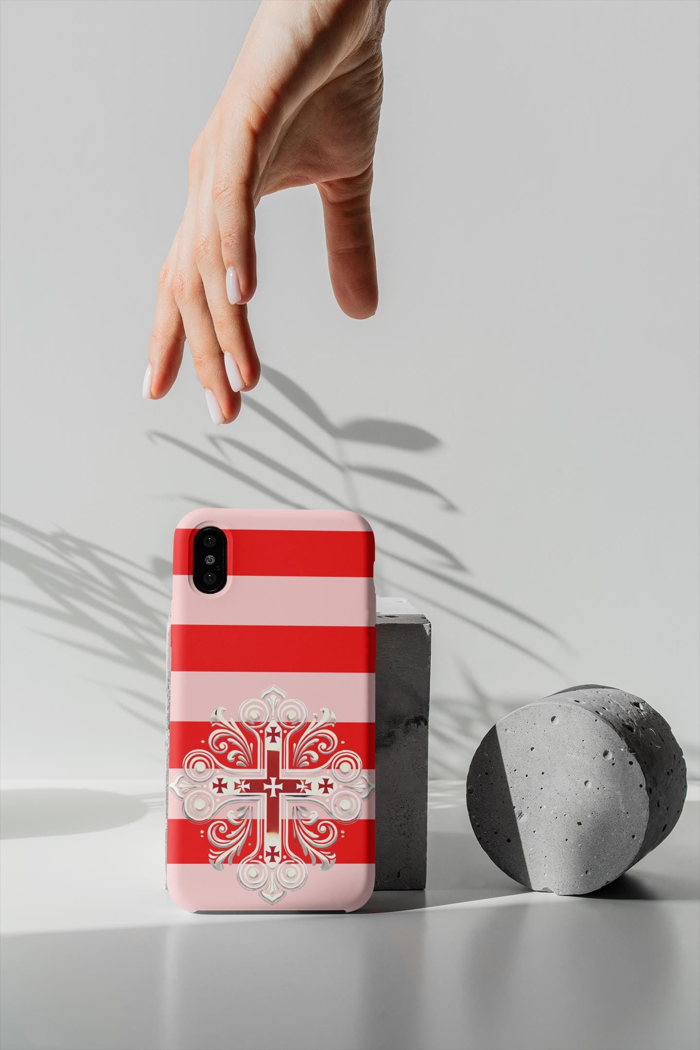 Showcase your Georgian Orthodox faith with this premium phone case featuring a Georgian Orthodox Cross in red and white. Made with polycarbonate & TPU, it’s durable, shock-absorbent, and wireless charging compatible.