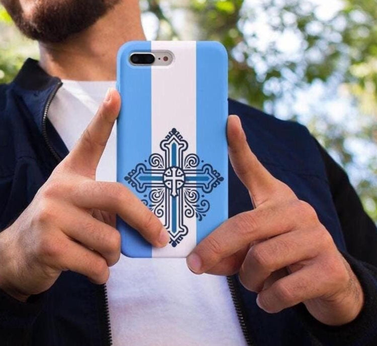 Showcase your Greek Orthodox faith with this premium phone case featuring a Greek Orthodox Cross in blue and white. Made with polycarbonate & TPU, it’s durable, shock-absorbent, and wireless charging compatible. The perfect Greek Orthodox gift.