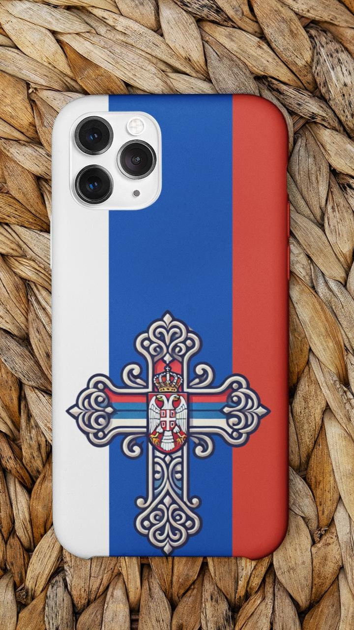 Showcase your Serbian Orthodox faith with this premium phone case featuring a Serbian Orthodox Cross in red, blue, and white. Made with polycarbonate & TPU, it’s durable, shock-absorbent, and wireless charging compatible. ✝️📱