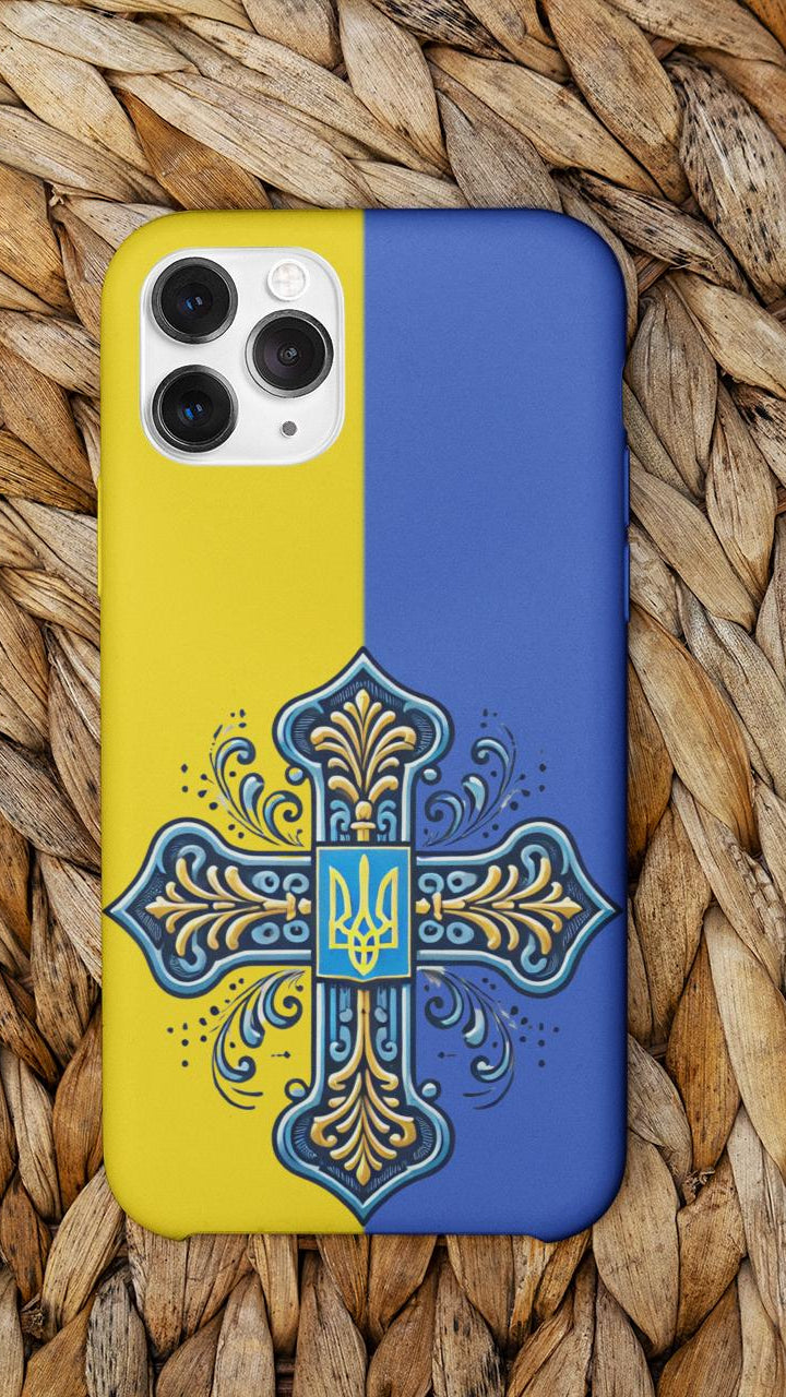 Showcase your Ukrainian Orthodox faith with this premium phone case featuring a Ukrainian Orthodox Cross in blue and yellow. Made with polycarbonate & TPU, it’s durable, shock-absorbent, and wireless charging compatible
