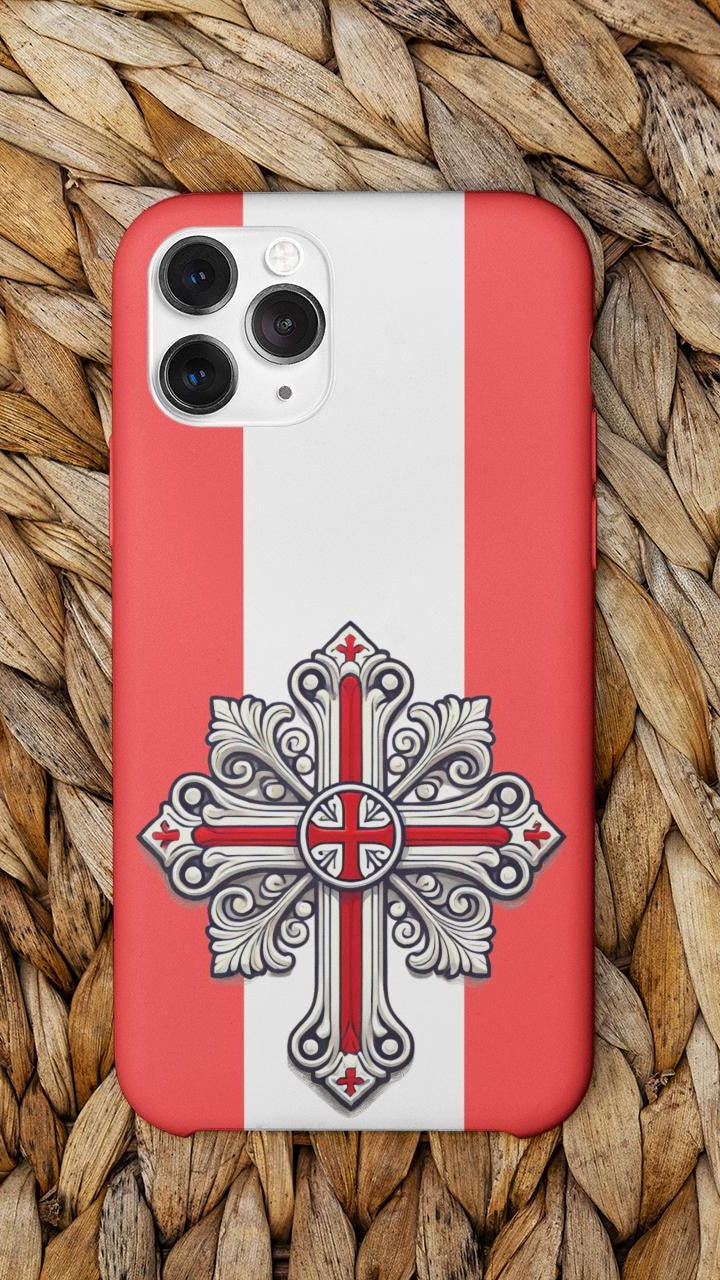 Showcase your English Christian faith with this premium phone case featuring an English Orthodox Cross in red and white. Made with polycarbonate & TPU, it’s durable, shock-absorbent, and wireless charging compatible.