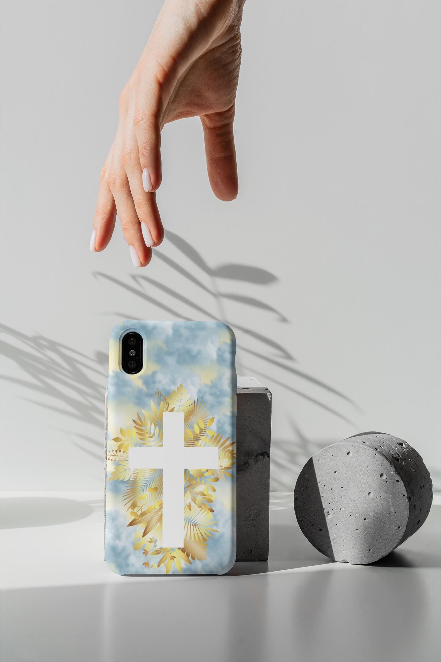 Carry your faith with this Christian Cross Phone Case! Featuring heavenly clouds and a radiant cross, it’s durable, lightweight & wireless charging compatible. A perfect Christian gift for iPhone & Samsung. Order now and stay inspired daily!