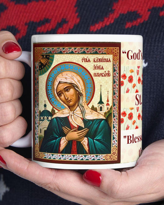 Saint Xenia of St. Petersburg 11oz ceramic mug with a detailed Orthodox Christian design. Durable, microwave- and dishwasher-safe, perfect for coffee, tea, or as a meaningful gift for baptisms, name days, or celebrations of faith