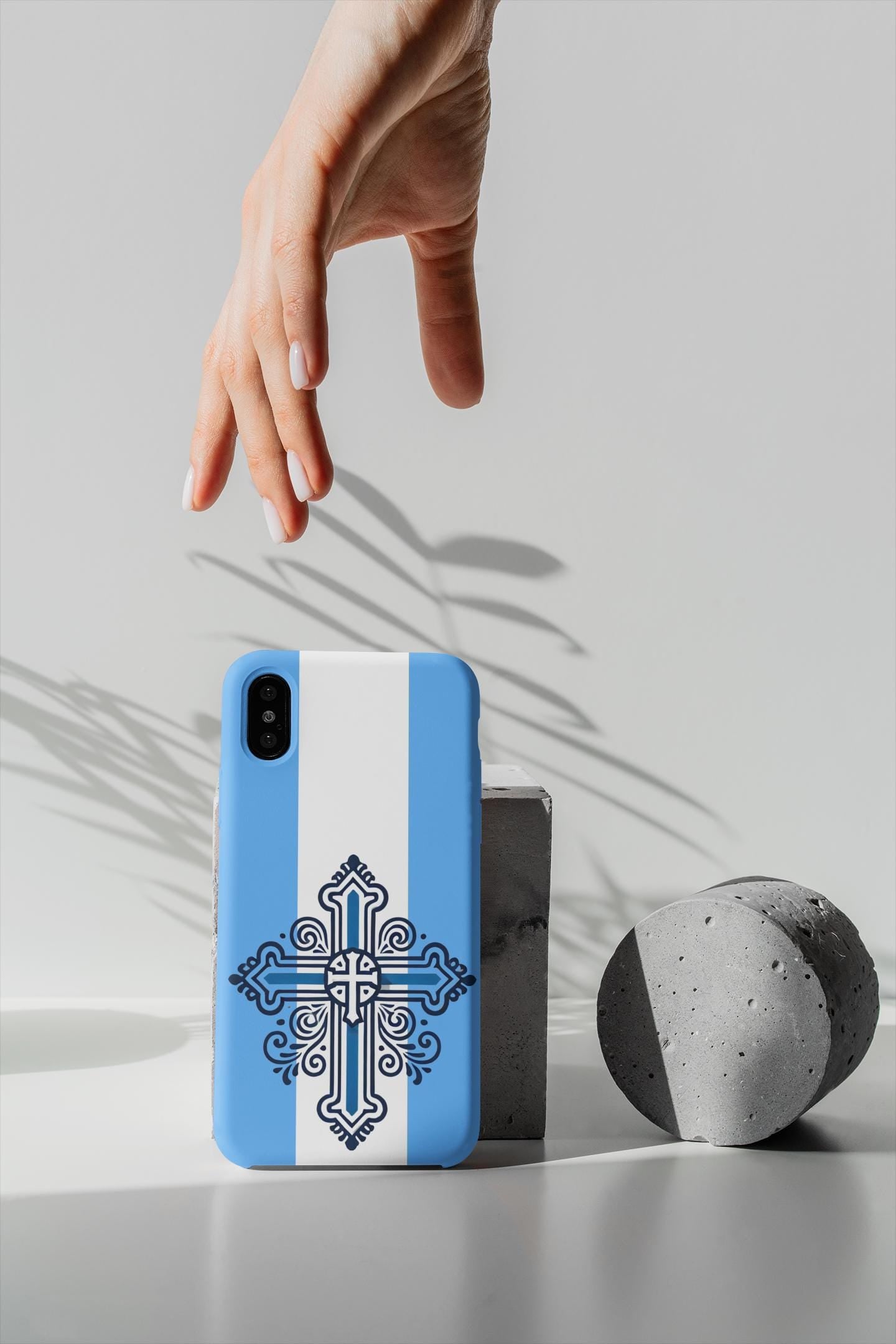 Showcase your Greek Orthodox faith with this premium phone case featuring a Greek Orthodox Cross in blue and white. Made with polycarbonate & TPU, it’s durable, shock-absorbent, and wireless charging compatible.