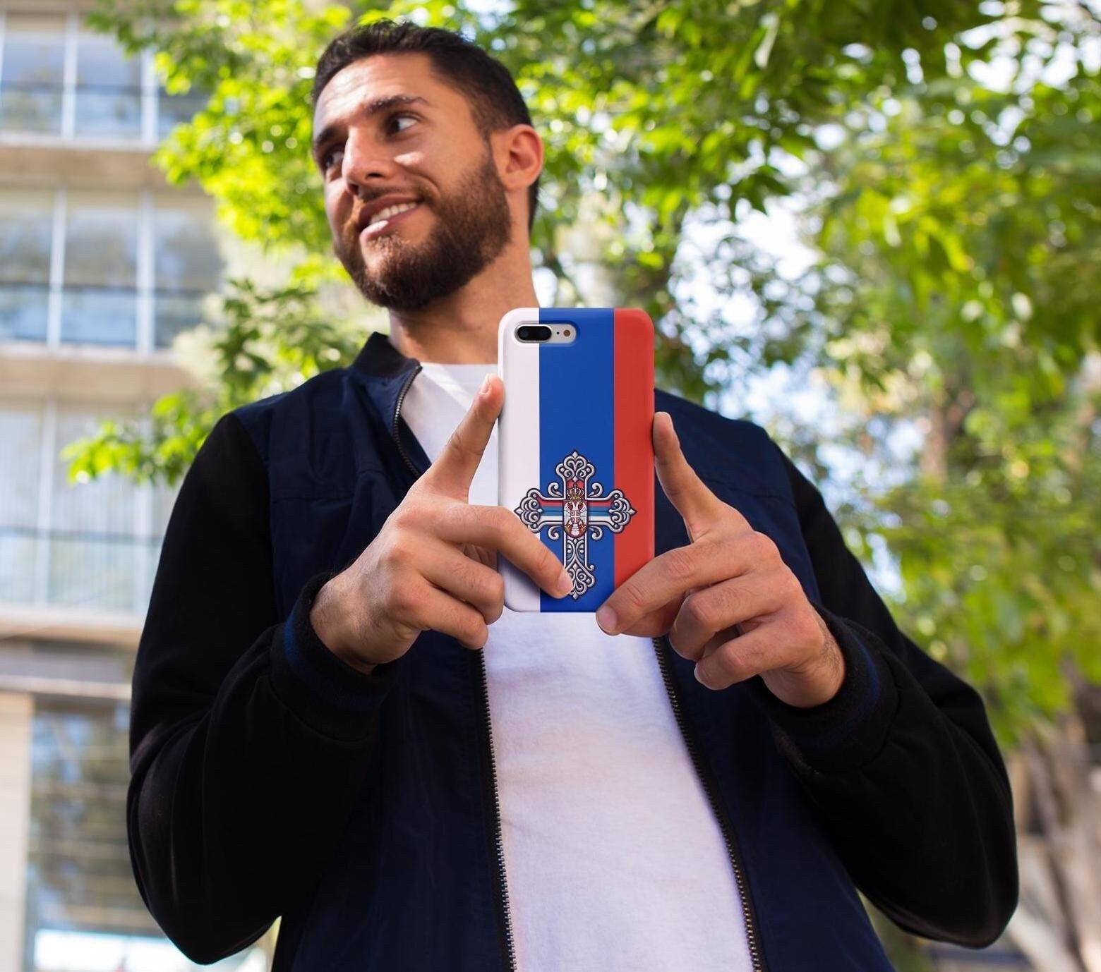 Showcase your Serbian Orthodox faith with this premium phone case featuring a Serbian Orthodox Cross in red, blue, and white. Made with polycarbonate & TPU, it’s durable, shock-absorbent, and wireless charging compatible. Perfect gift for Serbians.