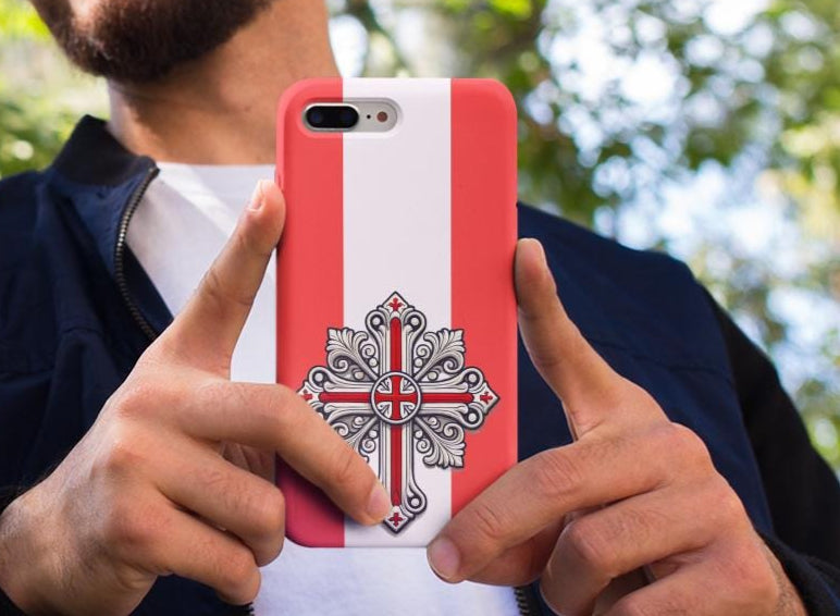 Showcase your English Christian faith with this premium phone case featuring an English Orthodox Cross in red and white. Made with polycarbonate & TPU, it’s durable, shock-absorbent, and wireless charging compatible.