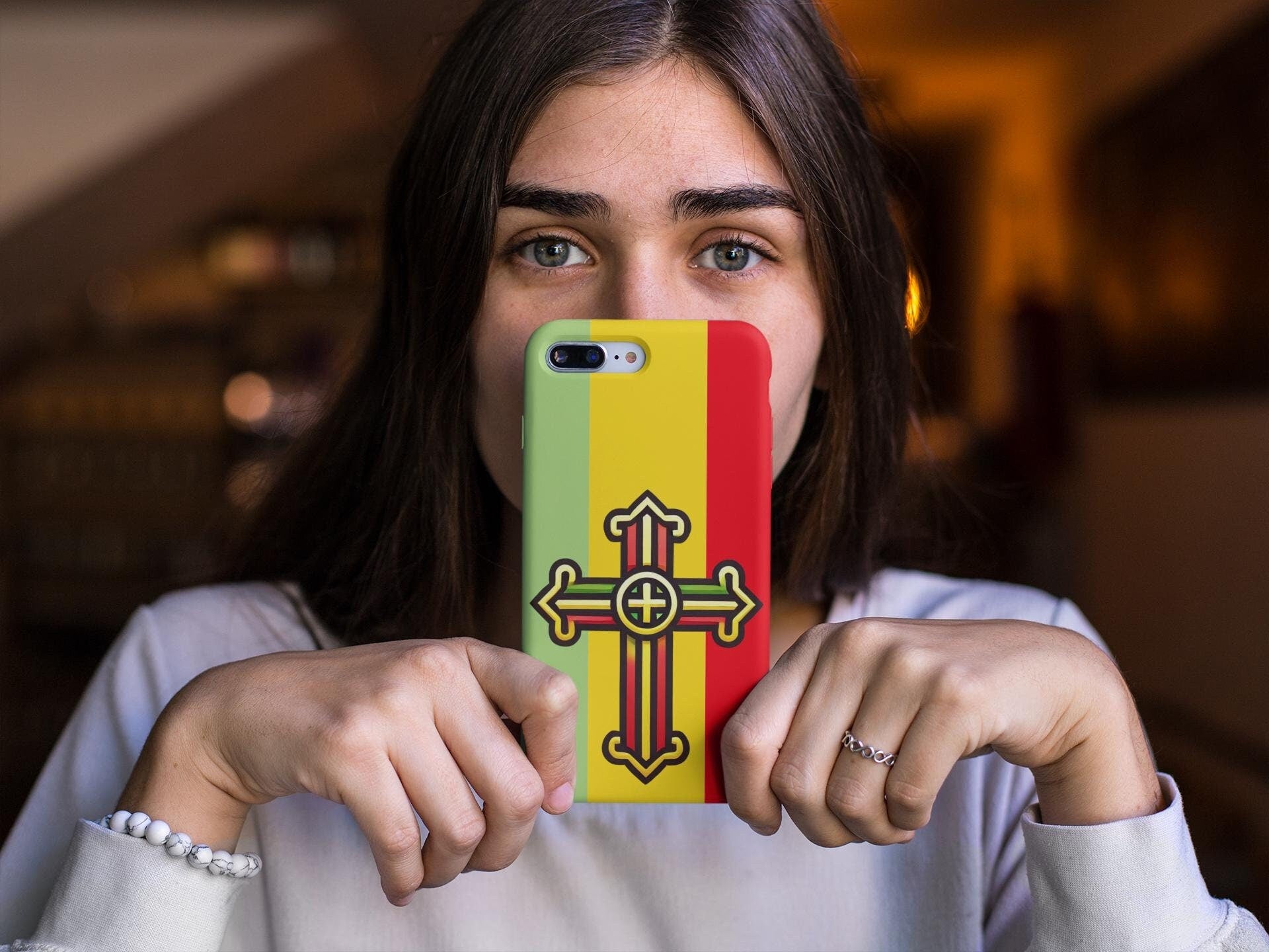 Show your Ethiopian Orthodox faith with this Tewahedo Cross Phone Case! Featuring a Ge’ez Orthodox design, it’s durable, lightweight & wireless charging compatible. A perfect Christian gift for iPhone & Samsung. Order now and carry your faith daily!