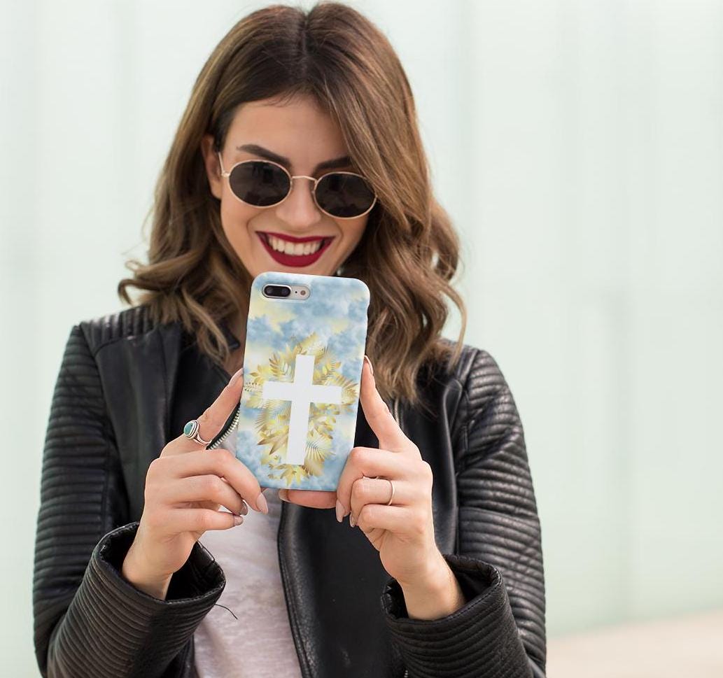 Carry your faith with this Christian Cross Phone Case! Featuring heavenly clouds and a radiant cross, it’s durable, lightweight & wireless charging compatible. A perfect Christian gift for iPhone & Samsung. Order now and stay inspired daily!