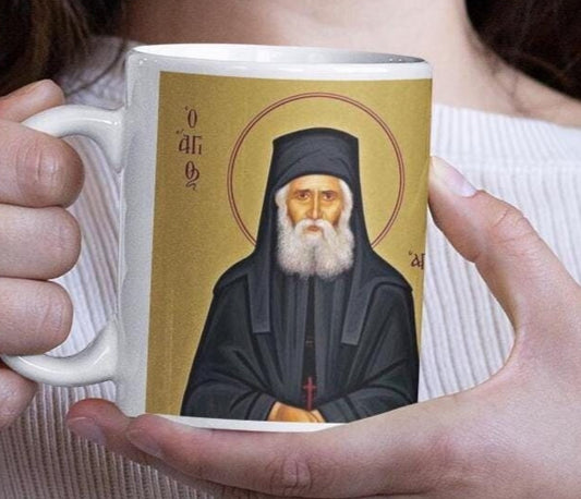 Celebrate Saint Paisios of Mount Athos with this Orthodox Christian Mug, featuring his inspiring quote: &quot;The goal of the Christian is to resemble Christ.&quot; Durable ceramic, microwave & dishwasher safe—perfect for daily use, prayer, or as a faith gift.